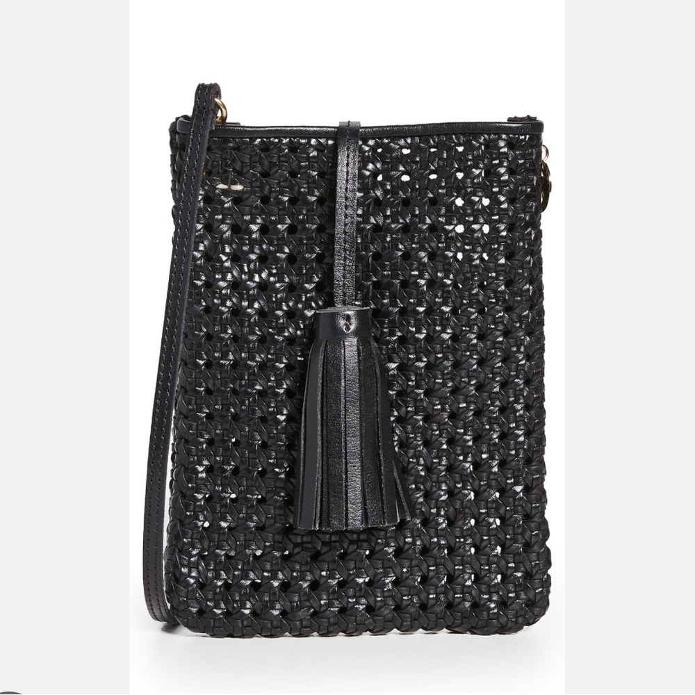 Clare V Poche Bag in Black rattan with tassel.